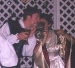 Bride and Groom drinking from large two handled goblet.